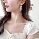 2025 high-end micro-inlaid zirconium hollow leaf feather earrings women's s925 silver needle niche design fashion earrings