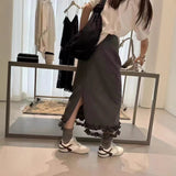 2025 spring Korean version fashionable versatile high waist rear split ruffle edge skirt medium and long temperament skirt women