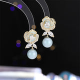 2025 drop glaze camellia pearl zircon earrings s925 silver needle small fragrance elegant fashion temperament sweet stud earrings