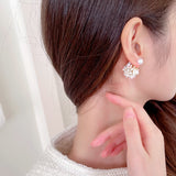 2025 S925 silver needle front and rear one two-wear flower cluster earrings niche design three-dimensional small ball pearl shell flower stud earrings