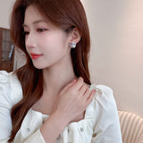 2025 fashion high sense niche commuter earrings light luxury zircon 925 silver needle temperament simple pearl stud earrings