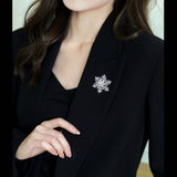 2025 Autumn and winter suit coat accessories high-end corsage copper inlaid zircon niche design double-layer rotatable snowflake brooch