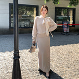 2025 popular autumn and winter new temperament bow knitted top + A-shaped half-length skirt two-piece set 25201