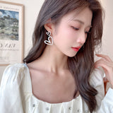 2025 Light luxury high-end love earrings Celebrity temperament inlaid hollow heart-shaped high-end S925 silver needle fashion earrings