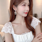 2025 Ethnic exotic style retro court style earrings copper inlaid zircon light luxury medieval tassel creative three-dimensional wind chime earrings
