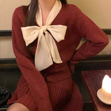 2025 popular autumn and winter loose long-sleeved temperament silver silk long-sleeved bow solid color knitted sweater sweater 25200