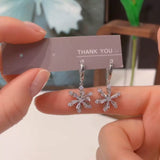 autumn and winter new snowflake zircon rotating ear buckle design sense shiny smart snowflake ear buckle thin earrings
