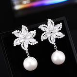 2025 high-end flower earrings super flash zircon windmill pearl earrings silver needle versatile creative bride earrings women