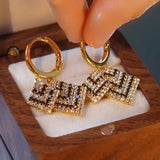 Autumn and winter new Qiandongge earrings black and white color matching rhombus ear buckle temperament thin full diamond geometric long earrings